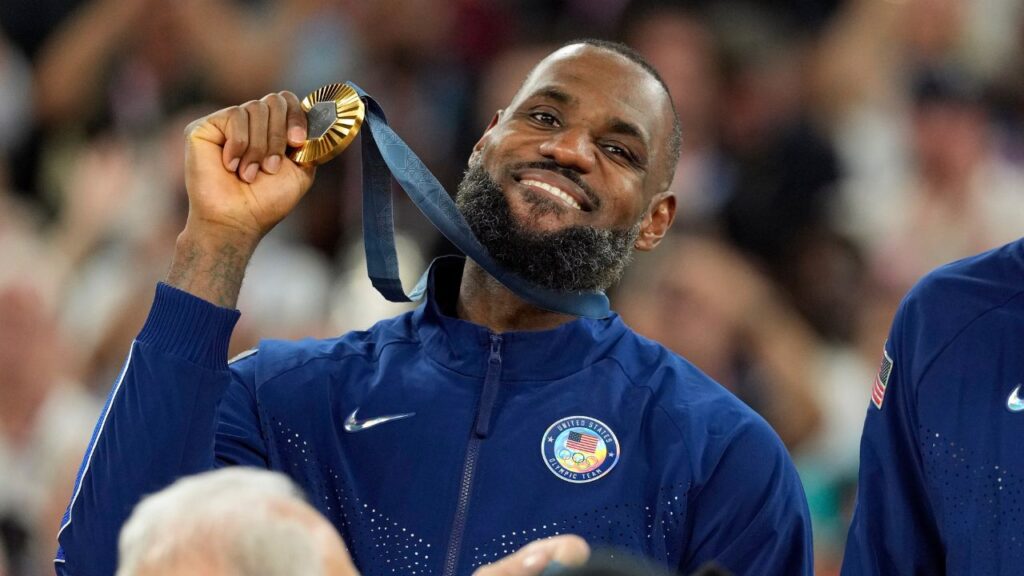 United States guard LeBron James (6) celebrates with the gold medal after the game against France in the men's basketball gold medal game during the Paris 2024 Olympic Summer Games at Accor Arena