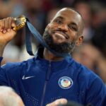 United States guard LeBron James (6) celebrates with the gold medal after the game against France in the men's basketball gold medal game during the Paris 2024 Olympic Summer Games at Accor Arena