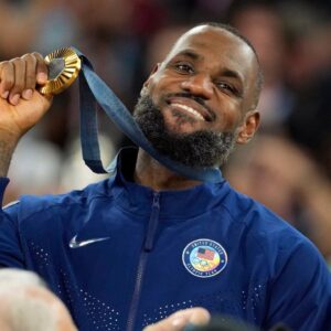 United States guard LeBron James (6) celebrates with the gold medal after the game against France in the men's basketball gold medal game during the Paris 2024 Olympic Summer Games at Accor Arena