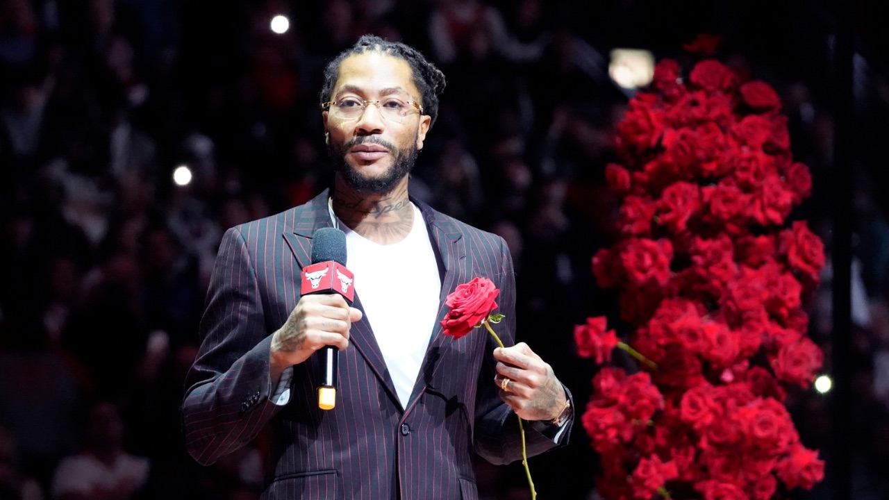 Chicago Bulls and New York Knicks former player Derrick Rose speaks as he is honored at halftime of a game between the Chicago Bulls and the New York Knicks at United Center.