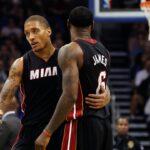 Miami Heat small forward Michael Beasley (8) talks with small forward LeBron James (6) during the second quarter at Amway Center.