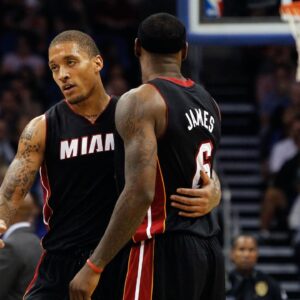 Miami Heat small forward Michael Beasley (8) talks with small forward LeBron James (6) during the second quarter at Amway Center.