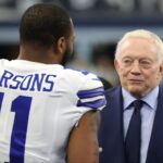 Dallas Cowboys outside linebacker Micah Parsons (11) meets with owner Jerry Jones (center) and NFL commissioner Roger Goodell (right) prior to the NFC Wild Card playoff football game against the San Francisco 49ers at AT&T Stadium.