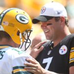Green Bay Packers quarterback Aaron Rodgers (12) and Pittsburgh Steelers quarterback Ben Roethlisberger (7) talk at mid-field before their game at Heinz Field.