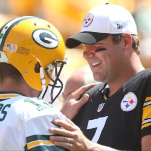 Green Bay Packers quarterback Aaron Rodgers (12) and Pittsburgh Steelers quarterback Ben Roethlisberger (7) talk at mid-field before their game at Heinz Field.