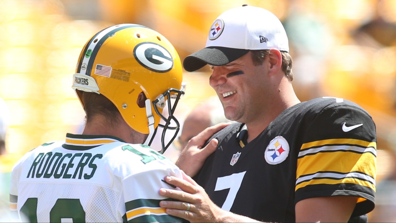 Green Bay Packers quarterback Aaron Rodgers (12) and Pittsburgh Steelers quarterback Ben Roethlisberger (7) talk at mid-field before their game at Heinz Field.