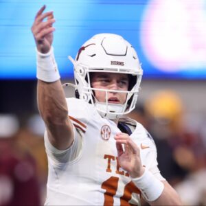 Texas Longhorns quarterback Arch Manning (16) warms up before the Peach Bowl at Mercedes-Benz Stadium.