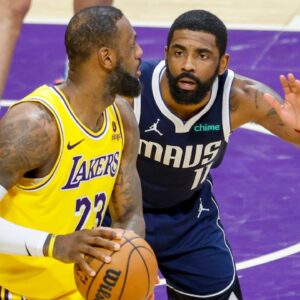 Los Angeles Lakers LeBron James 23 is defended by Dallas Mavericks Kyrie Irving 11 during an NBA, Basketball Herren, USA basketball game at Crypto.com Arena