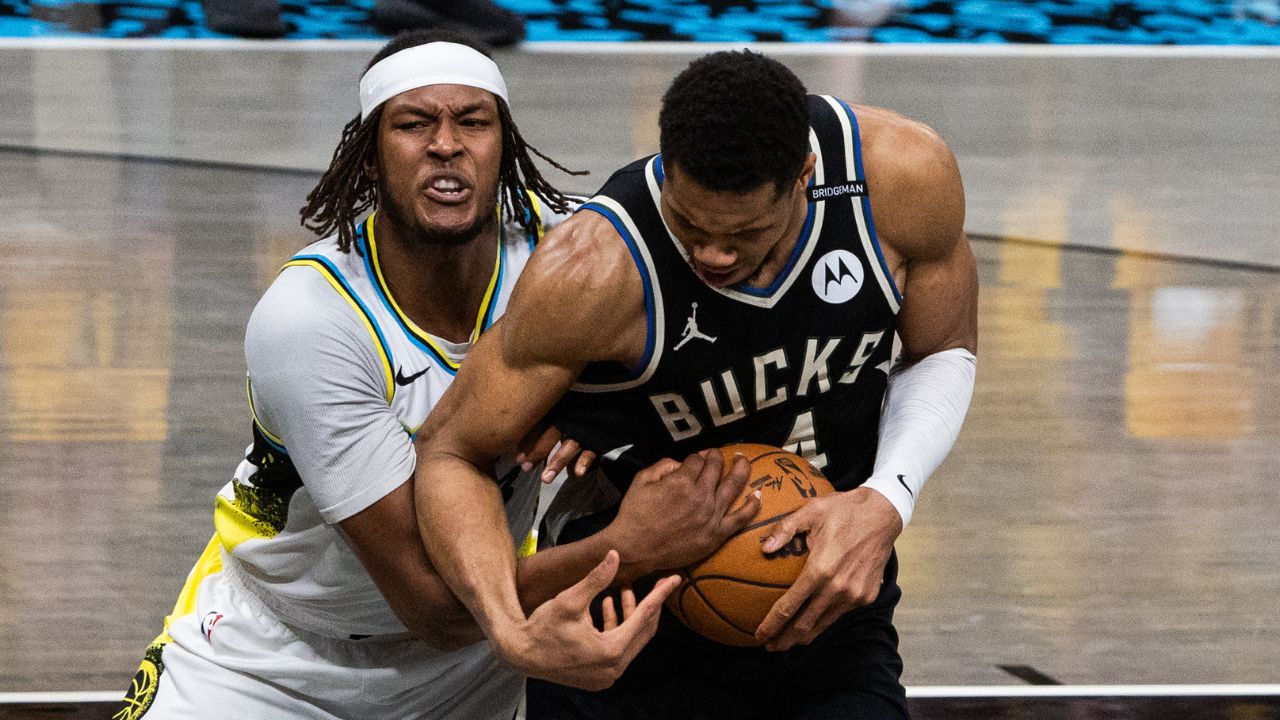 Indiana Pacers center Myles Turner (33) and Milwaukee Bucks forward Giannis Antetokounmpo (34) fight for the ball during game five of the first round for the 2024 NBA Playoffs at Gainbridge Fieldhouse.