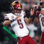 Washington Commanders quarterback Jayden Daniels (5) celebrates after a play against the Philadelphia Eagles during the second half in the NFC Championship game at Lincoln Financial Field.