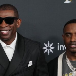 Deion Sanders with his sons Shedeur Sanders (left) and Deion Sanders Jr. (right) on the red carpet before Super Bowl LIX NFL Honors at Saenger Theatre.