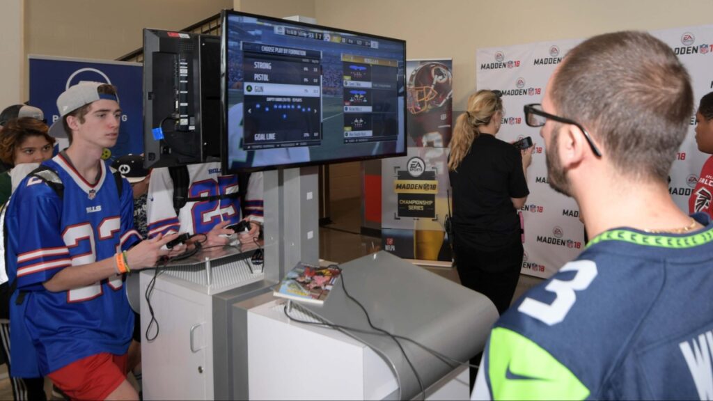 Fans play Madden NFL 18-video game by EA Sports at the 2018 Pro Bowl Experience at ESPN Wide World of Sports.
