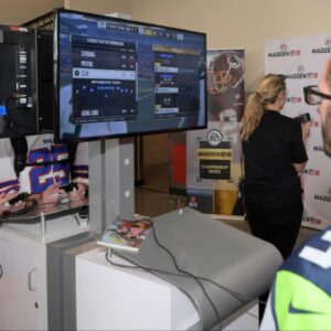 Fans play Madden NFL 18-video game by EA Sports at the 2018 Pro Bowl Experience at ESPN Wide World of Sports.