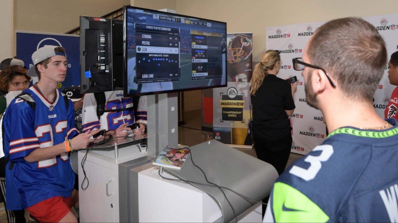 Fans play Madden NFL 18-video game by EA Sports at the 2018 Pro Bowl Experience at ESPN Wide World of Sports.