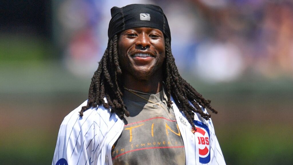 New Orleans Saints running back Alvin Kamara throws out a ceremonial first pitch prior to a game between the Chicago Cubs and the St. Louis Cardinals at Wrigley Field.