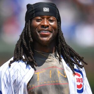 New Orleans Saints running back Alvin Kamara throws out a ceremonial first pitch prior to a game between the Chicago Cubs and the St. Louis Cardinals at Wrigley Field.