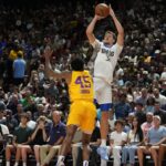 Dallas Mavericks forward Cooper Flagg (32) shoots against Los Angeles Lakers guard DaJaun Gordon (45) in the first quarter of their game at Thomas & Mack Center.