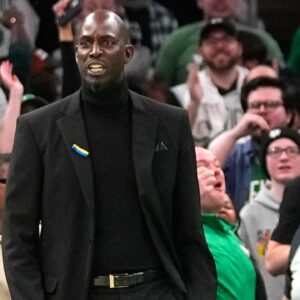 Former Boston Celtic Kevin Garnett reacts to Boston Celtics shooting guard Jaylen Brown (7) dunk (not pictured) during the first half against the Dallas Mavericks at TD Garden.