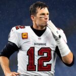 Tampa Bay Buccaneers quarterback Tom Brady (12) blows a kiss to fans after a game against the New England Patriots at Gillette Stadium.