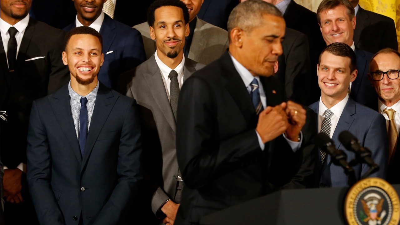 President Barack Obama (center) imitates a celebration dance of Golden State Warriors guard Stephen Curry (center) while speaking during a ceremony honoring the 2015 NBA Champion Warriors in the East Room at the White House.
