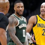 Milwaukee Bucks guard Damian Lillard (0) and Indiana Pacers guard Andrew Nembhard (2) talk with referee Marc Davis during game three of first round for the 2024 NBA Playoffs at Fiserv Forum