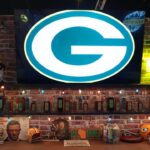 A Green Bay Packers logo at the Packer Everywhere Draft Haus at the NFL Draft Experience at Lambeau Field.