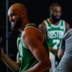 Oct 2, 2023; Boston, Celtics, USA; Boston Celtics guard Derrick White (9) and Boston Celtics guard Jaylen Brown (7) talk with sports media during Boston Celtics Media Day.