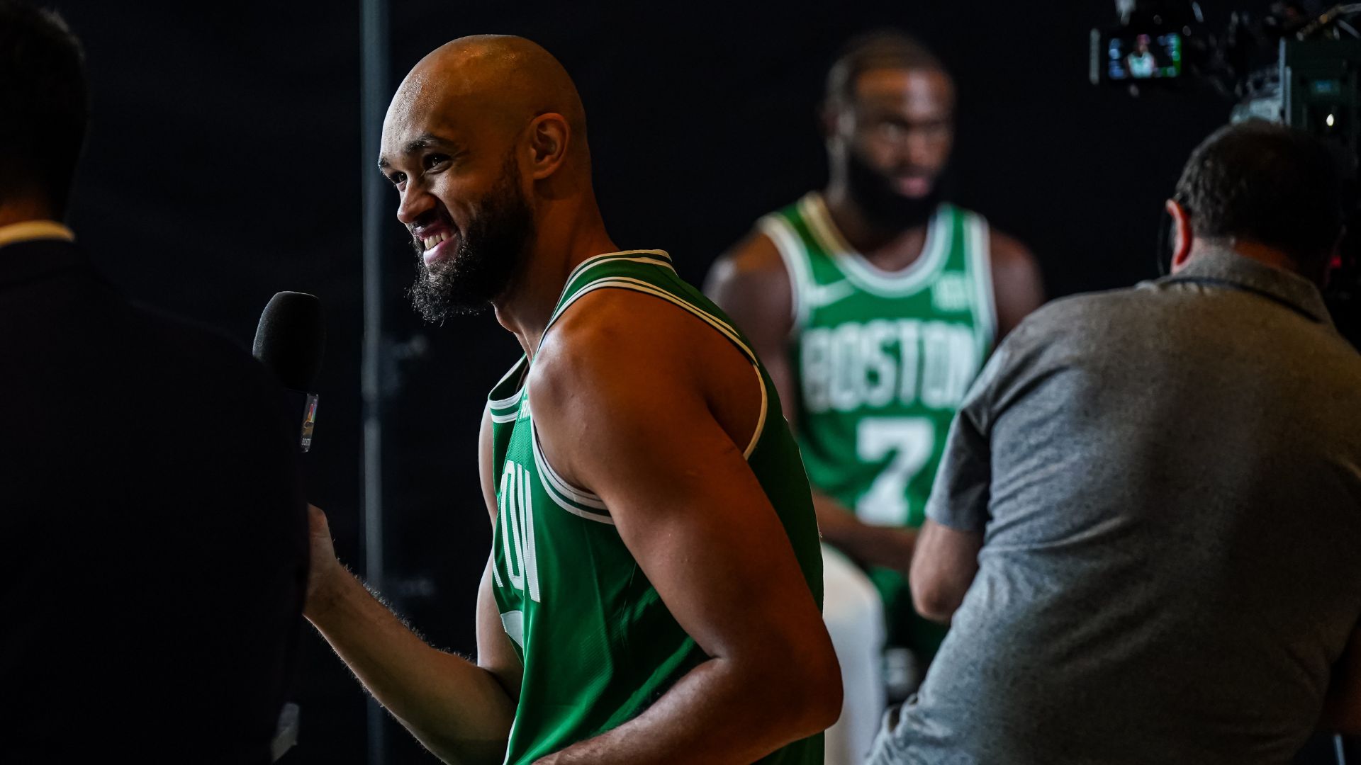 Oct 2, 2023; Boston, Celtics, USA; Boston Celtics guard Derrick White (9) and Boston Celtics guard Jaylen Brown (7) talk with sports media during Boston Celtics Media Day.