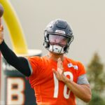 Chicago Bears quarterback Caleb Williams (18) passes the ball during training camp at Halas Hall.