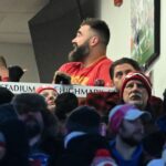 Jason Kelce (right) and Kylie Kelce (left) watch the game from the suites in the first half of the 2024 AFC divisional round game between the Buffalo Bills and the Kansas City Chiefs at Highmark Stadium.