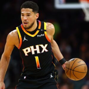 Phoenix Suns guard Devin Booker (1) dribbles the ball against the Oklahoma City Thunder during the first half at Footprint Center.