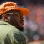 Former professional basketball player Carmelo Anthony attends a game between the Baltimore Orioles and the Tampa Bay Rays at Oriole Park at Camden Yards.