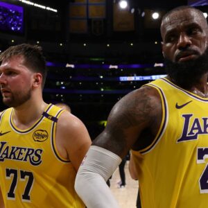 Apr 22, 2025; Los Angeles, California, USA; Los Angeles Lakers guard Luka Doncic (77) and Los Angeles Lakers forward LeBron James (23) leave a court after defeating the Minnesota Timberwolves 94-85 in game two of first round for the 2024 NBA Playoffs at Crypto.com Arena.