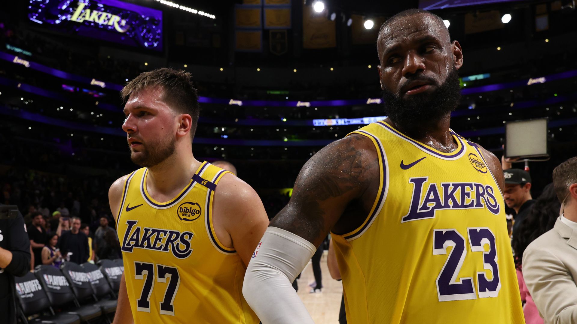Apr 22, 2025; Los Angeles, California, USA; Los Angeles Lakers guard Luka Doncic (77) and Los Angeles Lakers forward LeBron James (23) leave a court after defeating the Minnesota Timberwolves 94-85 in game two of first round for the 2024 NBA Playoffs at Crypto.com Arena.