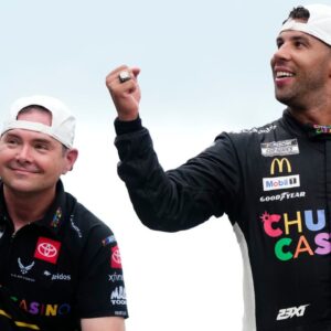 NASCAR Cup Series driver Bubba Wallace (23) celebrates with crew chief Charles Denike on the yard of bricks Sunday, July 27, 2025, during the Brickyard 400 at Indianapolis Motor Speedway.