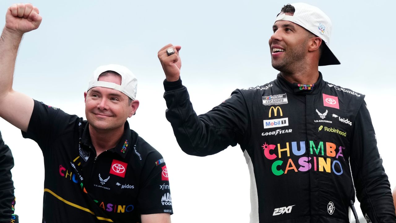 NASCAR Cup Series driver Bubba Wallace (23) celebrates with crew chief Charles Denike on the yard of bricks Sunday, July 27, 2025, during the Brickyard 400 at Indianapolis Motor Speedway.