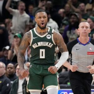 Milwaukee Bucks guard Damian Lillard (0) reacts after making a basket against the Indiana Pacers in the second half during game three of first round for the 2024 NBA Playoffs at Fiserv Forum.