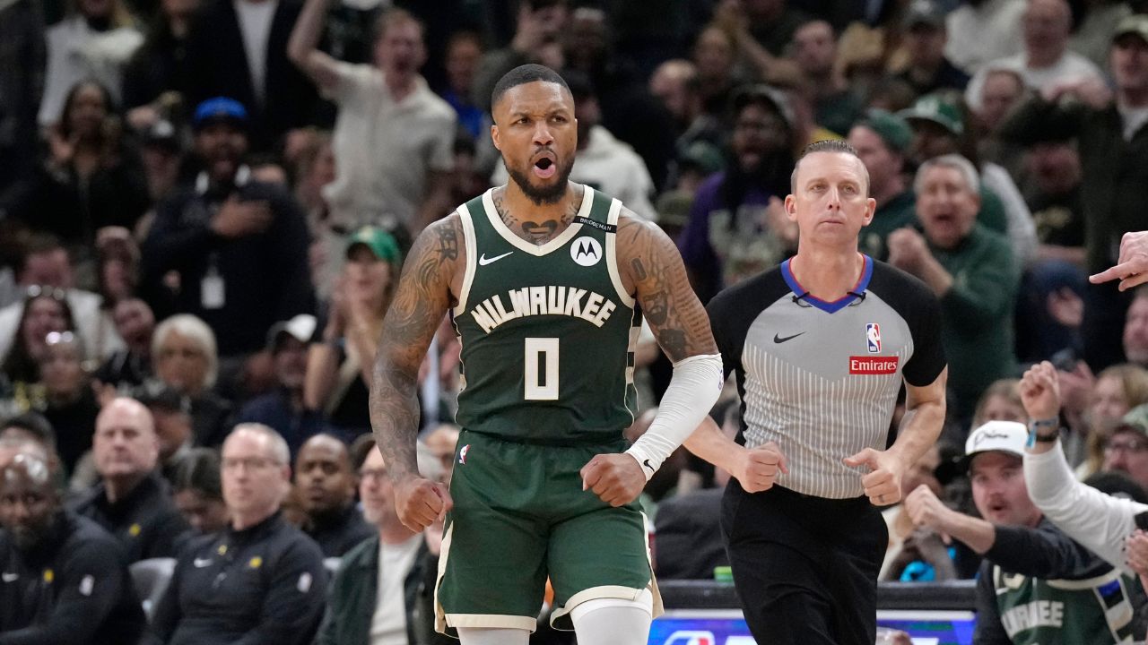 Milwaukee Bucks guard Damian Lillard (0) reacts after making a basket against the Indiana Pacers in the second half during game three of first round for the 2024 NBA Playoffs at Fiserv Forum.