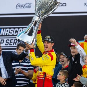 NASCAR Cup Series driver Joey Logano (22) celebrates with the Bill France Trophy after winning the 2024 NASCAR Cup Series championship and the NASCAR Cup Series Championship race at Phoenix Raceway.