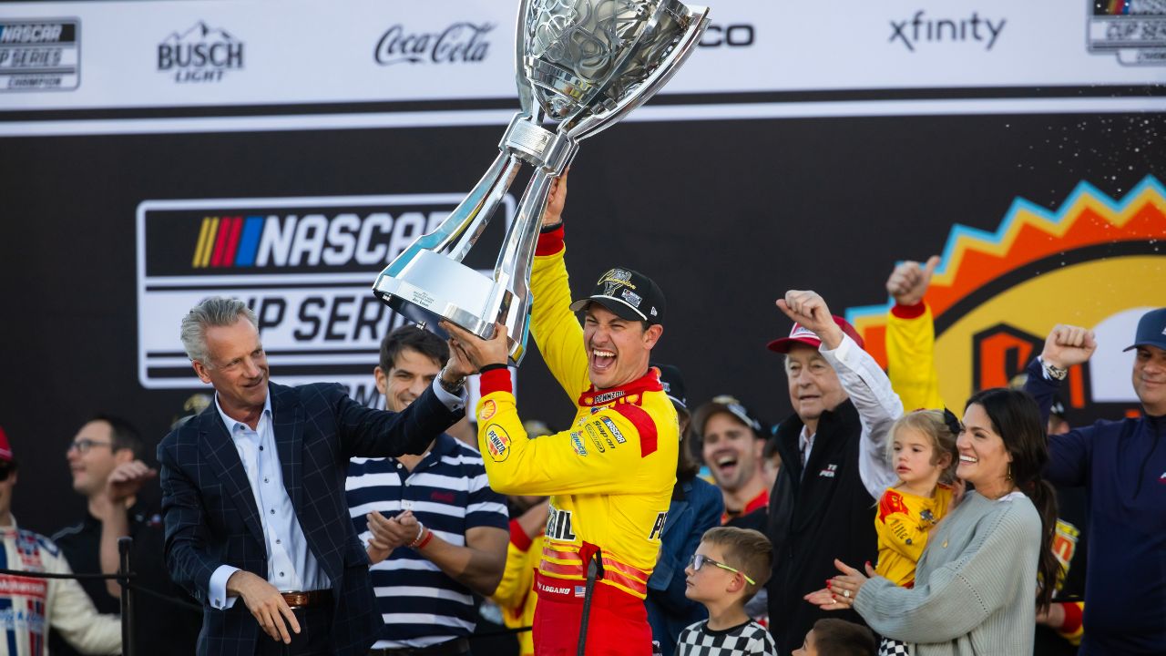 NASCAR Cup Series driver Joey Logano (22) celebrates with the Bill France Trophy after winning the 2024 NASCAR Cup Series championship and the NASCAR Cup Series Championship race at Phoenix Raceway.