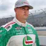 NASCAR Cup Series driver Ryan Preece walks on pit road as rain falls delaying the start of practice and qualifying for the Autotrader EchoPark Automotive 400 at Dover Motor Speedway.