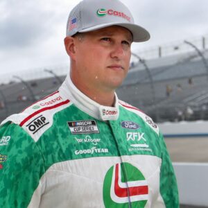 NASCAR Cup Series driver Ryan Preece walks on pit road as rain falls delaying the start of practice and qualifying for the Autotrader EchoPark Automotive 400 at Dover Motor Speedway.