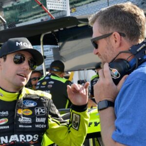 NASCAR Cup Series driver Ryan Blaney (12) talks with Dale Earnhardt Jr. on Saturday, July 30, 2022, during practice for the Verizon 200 at the Brickyard at Indianapolis Motor Speedway.