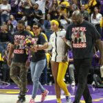 LSU s Angel Reese (10) is escorted to center court for senior night by her parents and Shaquille O Neal at halftime of NCAA, College League, USA Women s Basketball game action between the Kentucky Wildcats and the LSU Tigers at the Pete Maravich Assembly Center in Baton Rouge, LA