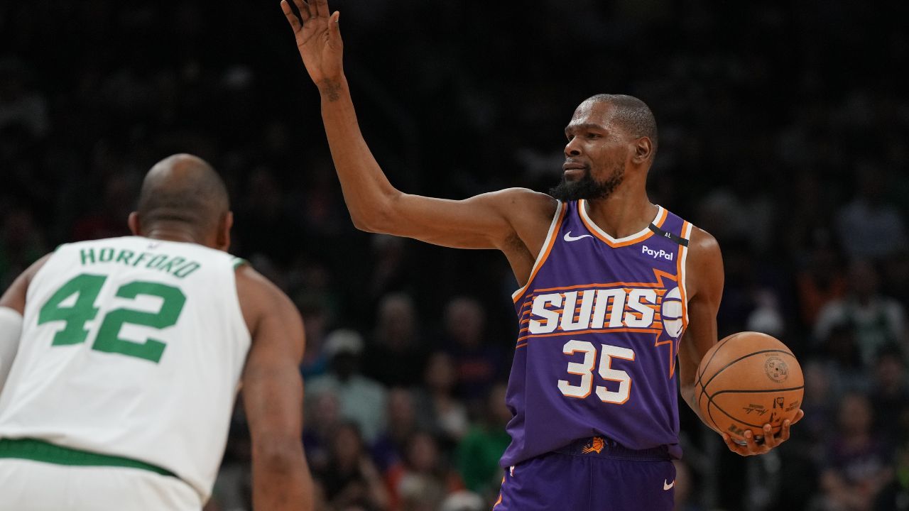 Phoenix Suns forward Kevin Durant (35) calls out a play against the Boston Celtics during the first half at Footprint Center.