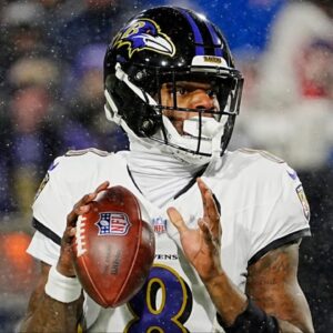 Baltimore Ravens quarterback Lamar Jackson gets ready to launch the ball during first half action at the Buffalo Bills divisional game against the Baltimore Ravens at Highmark Stadium in Orchard Park on Jan. 19, 2025.