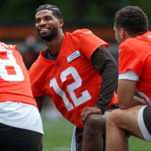 Browns quarterbacks Shedeur Sanders (12), Kenny Pickett (8) and Joe Flacco (15) talk during minicamp June 10, 2025, in Berea, Ohio.