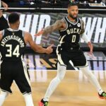 Milwaukee Bucks guard Damian Lillard (0) and forward Giannis Antetokounmpo (34) celebrate after a play during the 3rd quarter of the Emirates NBA Cup championship game against the Oklahoma City Thunder at T-Mobile Arena