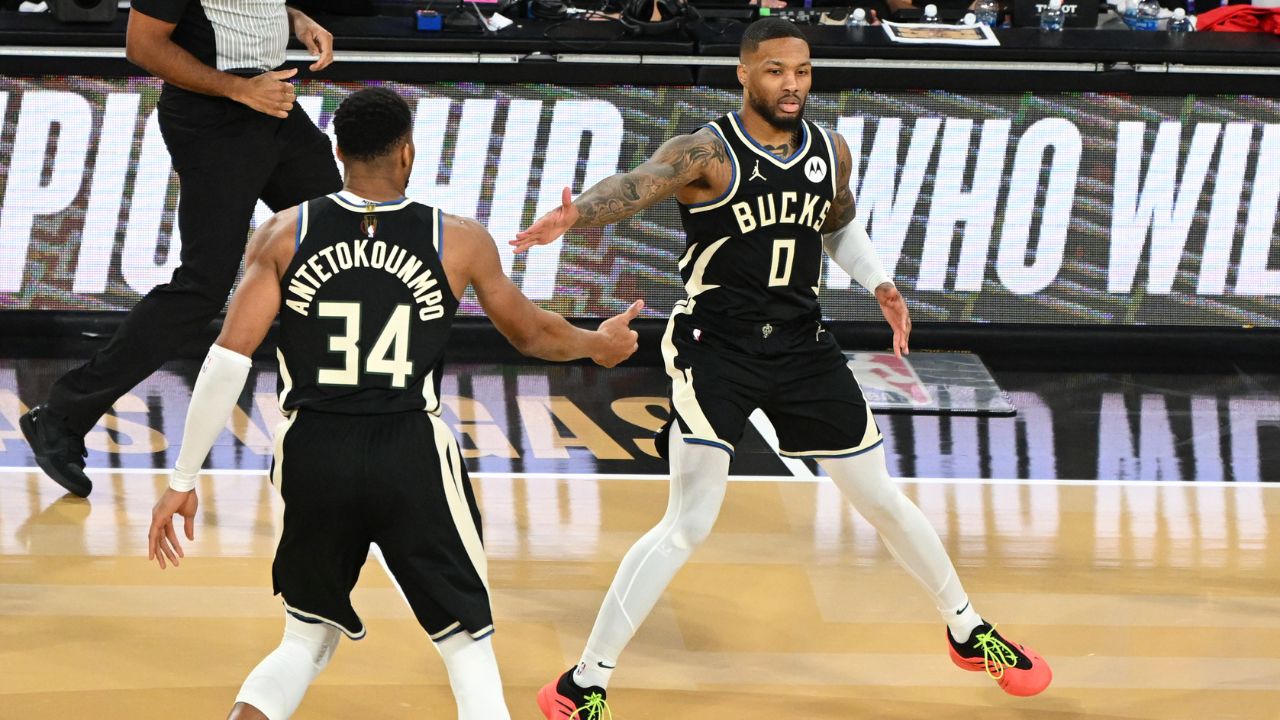 Milwaukee Bucks guard Damian Lillard (0) and forward Giannis Antetokounmpo (34) celebrate after a play during the 3rd quarter of the Emirates NBA Cup championship game against the Oklahoma City Thunder at T-Mobile Arena