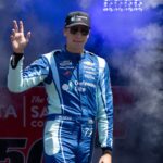 NASCAR Cup Series driver Carson Hocevar (77) waves after being introduced to fans before the start of the NASCAR Toyota / Save Mart 360 at Sonoma Raceway.